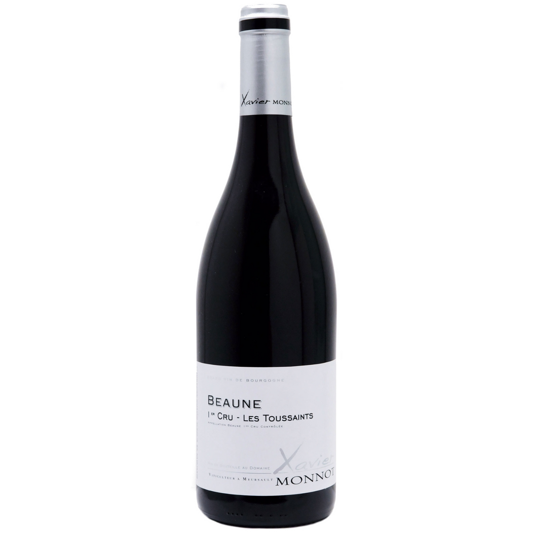 Bottle of Xavier Monnot Les Toussaints 2021, a Pinot Noir red wine from Beaune, France.